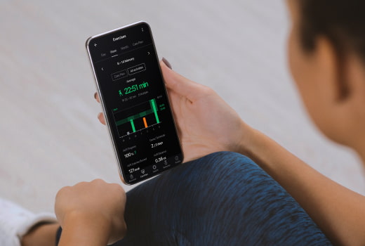 A person examining work out statistics on a phone