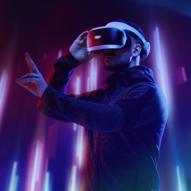 A person in a headset experiencing virtual reality