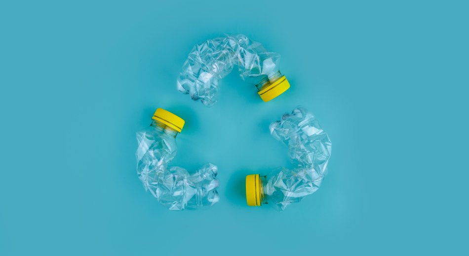 Three plastic bottles forming a recycling sign