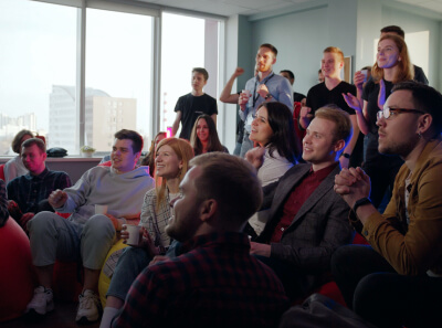  The company team watching a football match