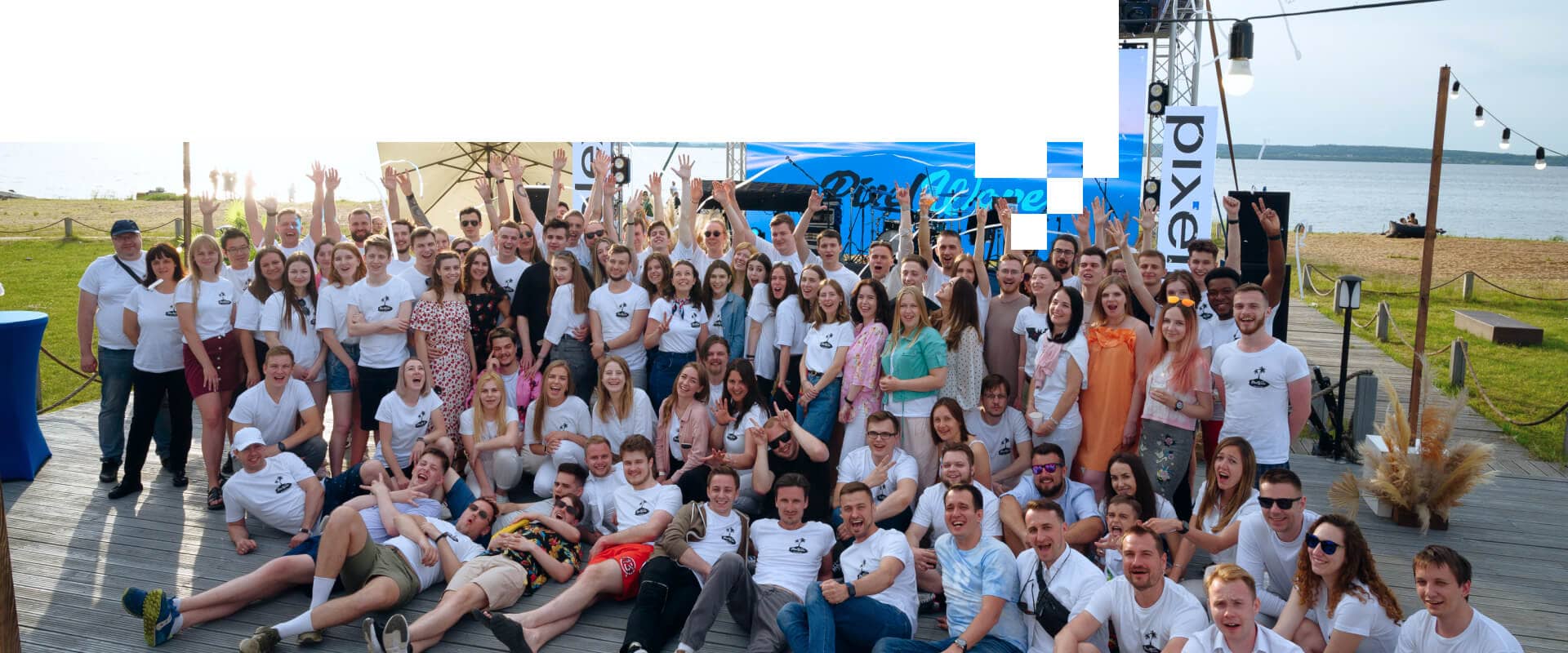 The company employees celebrating on a lake background