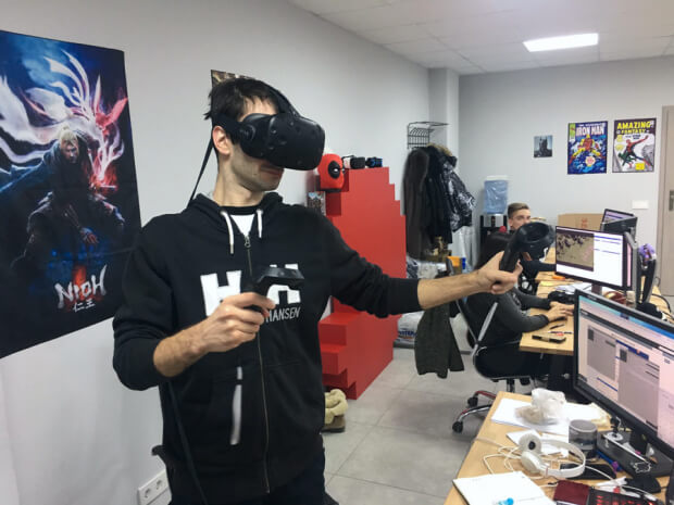 A man in a VR headset in the office