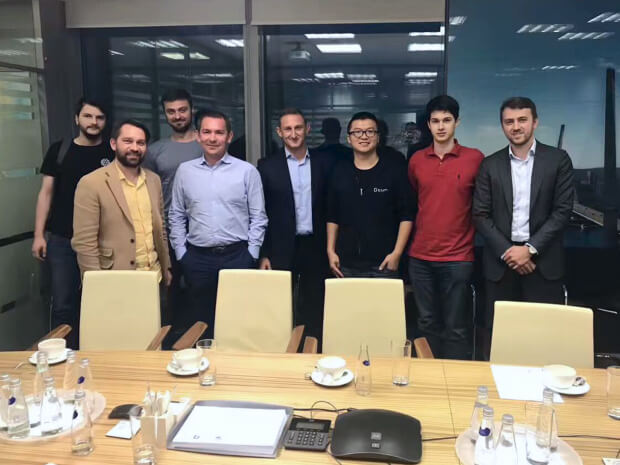 The photo of PixelPlex team with partners