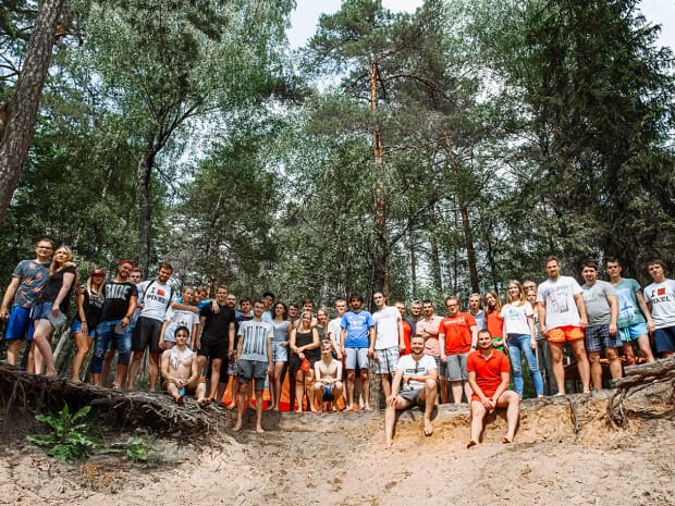 The company team on teambuilding in woods