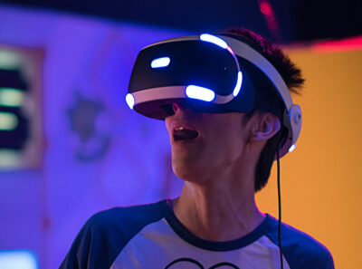 A man in a VR headset experiencing a metaverse