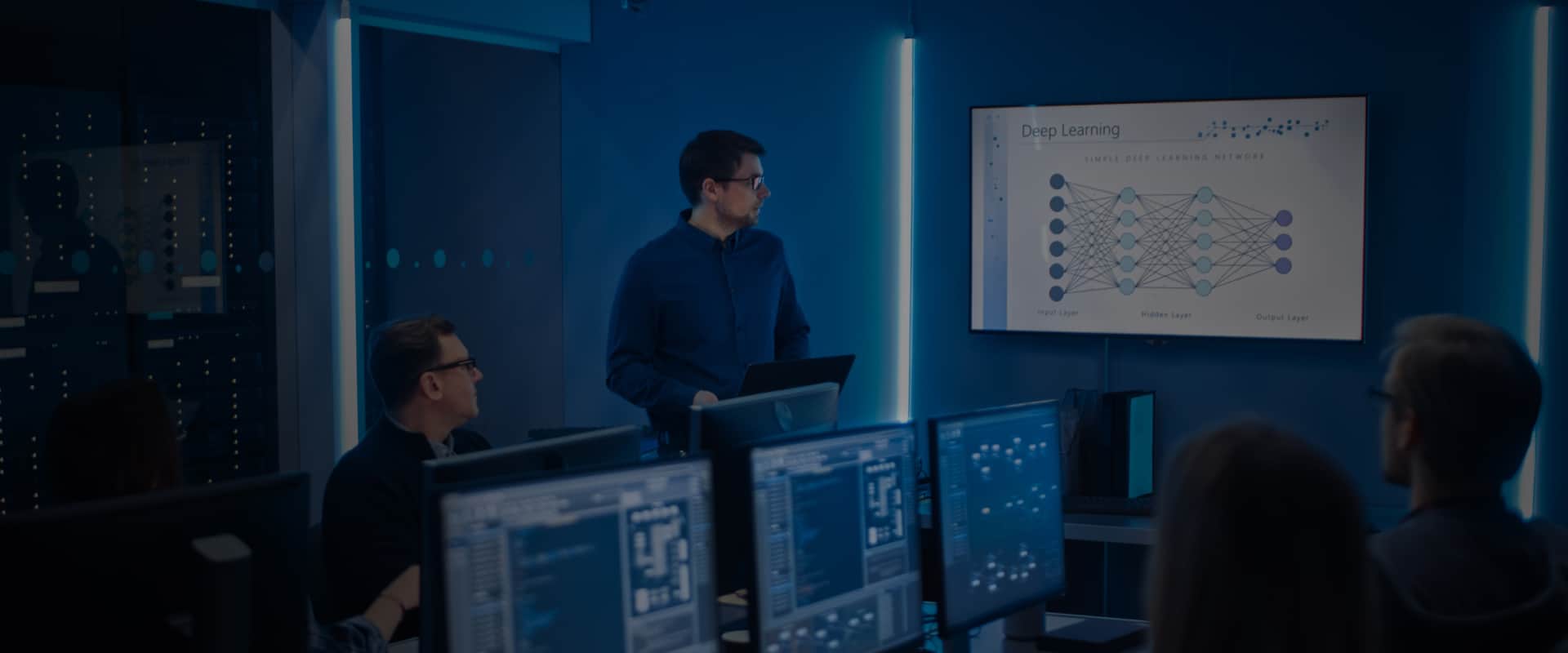 A person presenting analytics data in front of a team