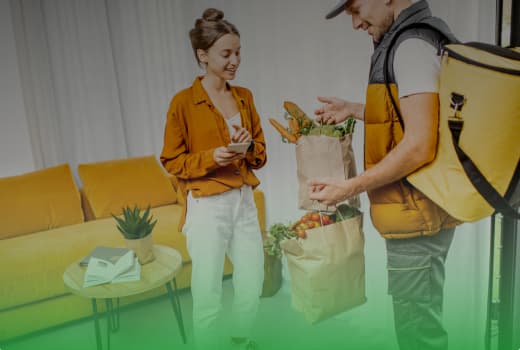 A courier completes a delivery from a grocery store