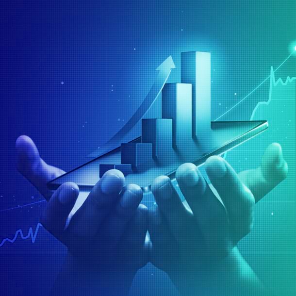 Hands holding a tablet displaying a colorful graph, illustrating data trends and analysis.