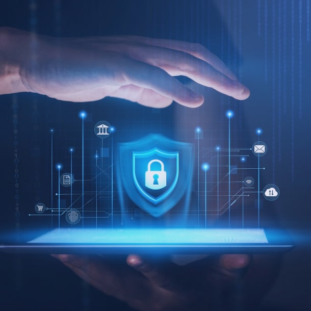 A person in an orange sweater provides eCommerce and retail software development consultation via a laptop