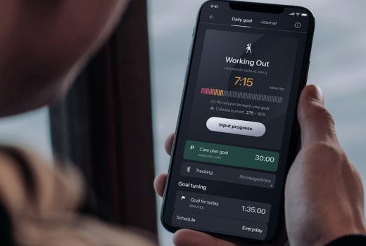 A person tracks workout statistics on a phone