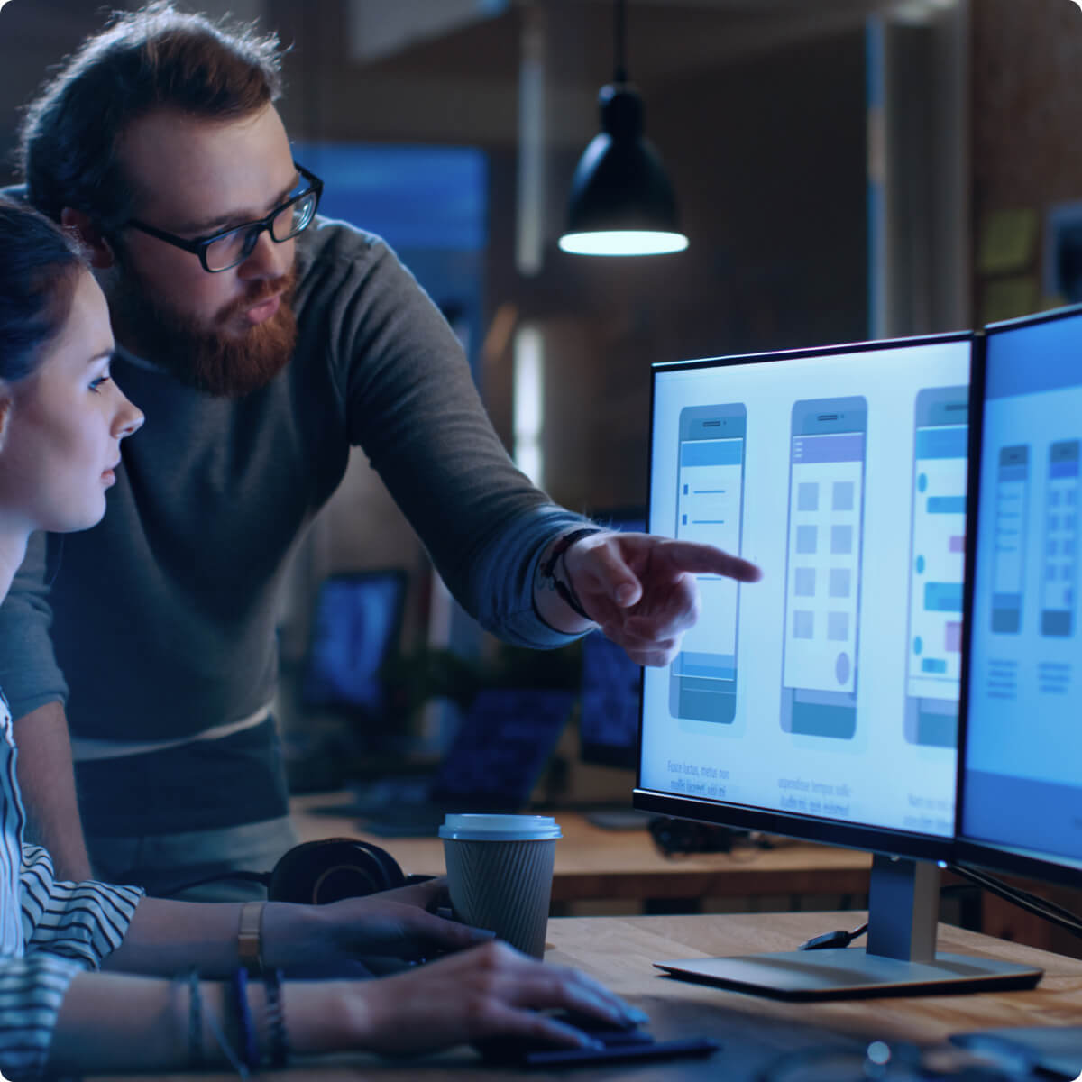 Two people discussing the interface of an app