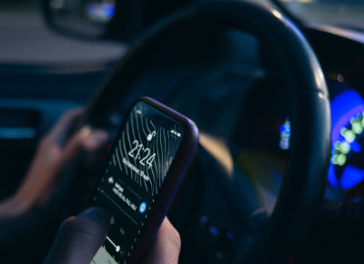 A person controlling CarPlay from his phone