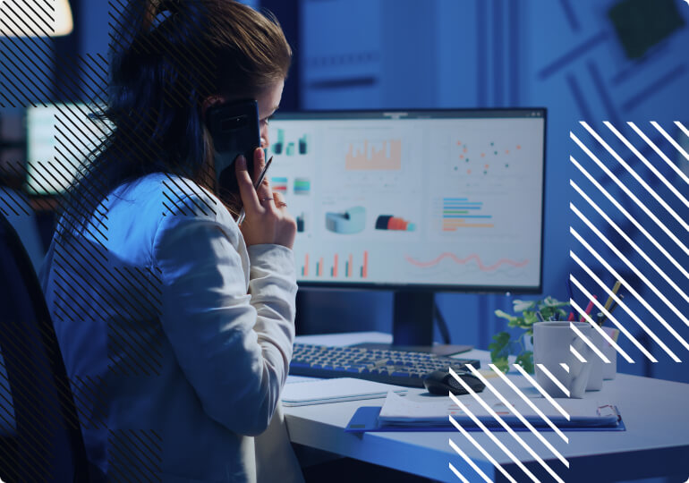 A person at the desk provides IoT consulting on a phone