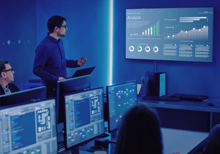 A person presenting the report to colleagues