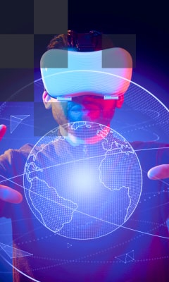 A man in a VR headset examining the Earth