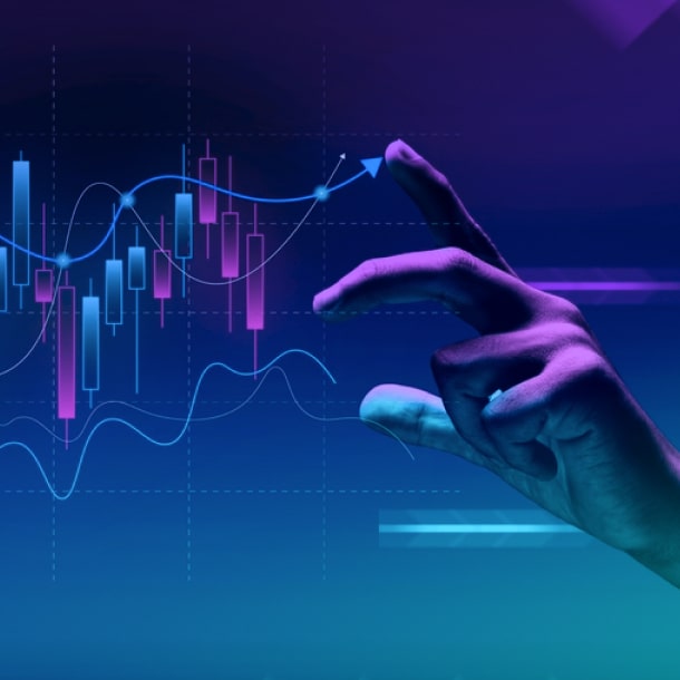 A human hand and a chart demonstrating the capabilities of predictive analytics consulting services