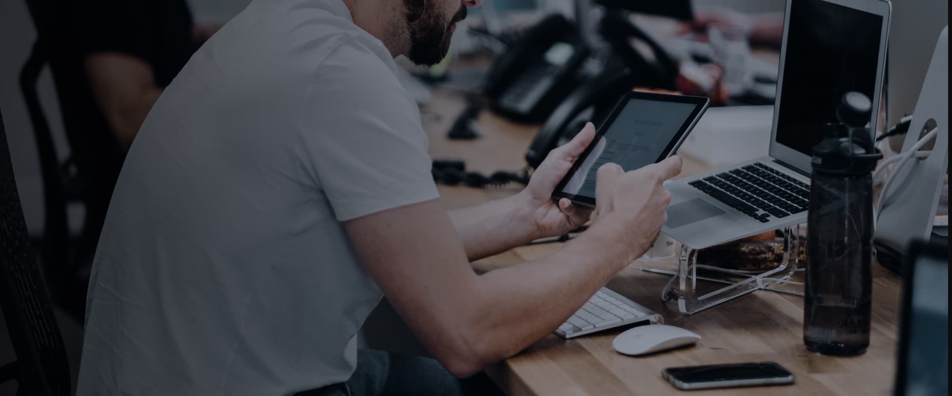 A person testing an app on a tablet