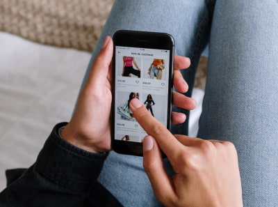 A person chooses clothing in a digital marketplace to place an order