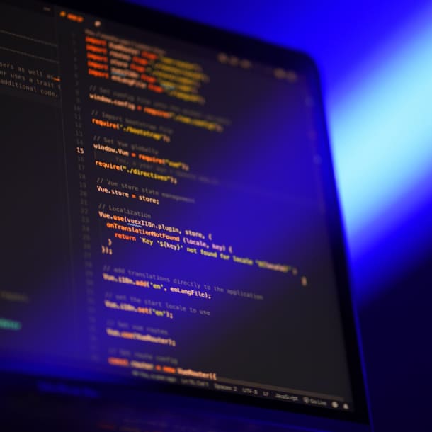 An orange-color code snippet on a laptop display