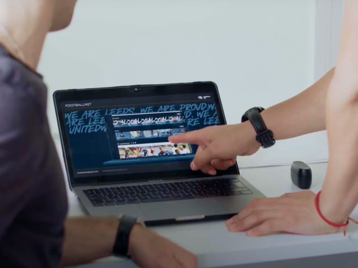 Two people discussing the design of a page