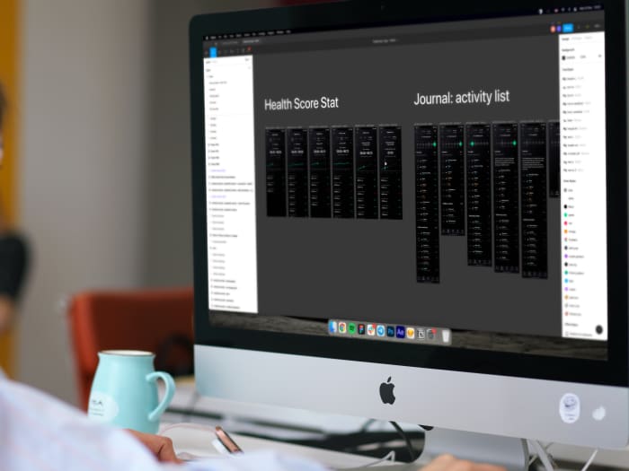A person designing the interface of a mobile and web app