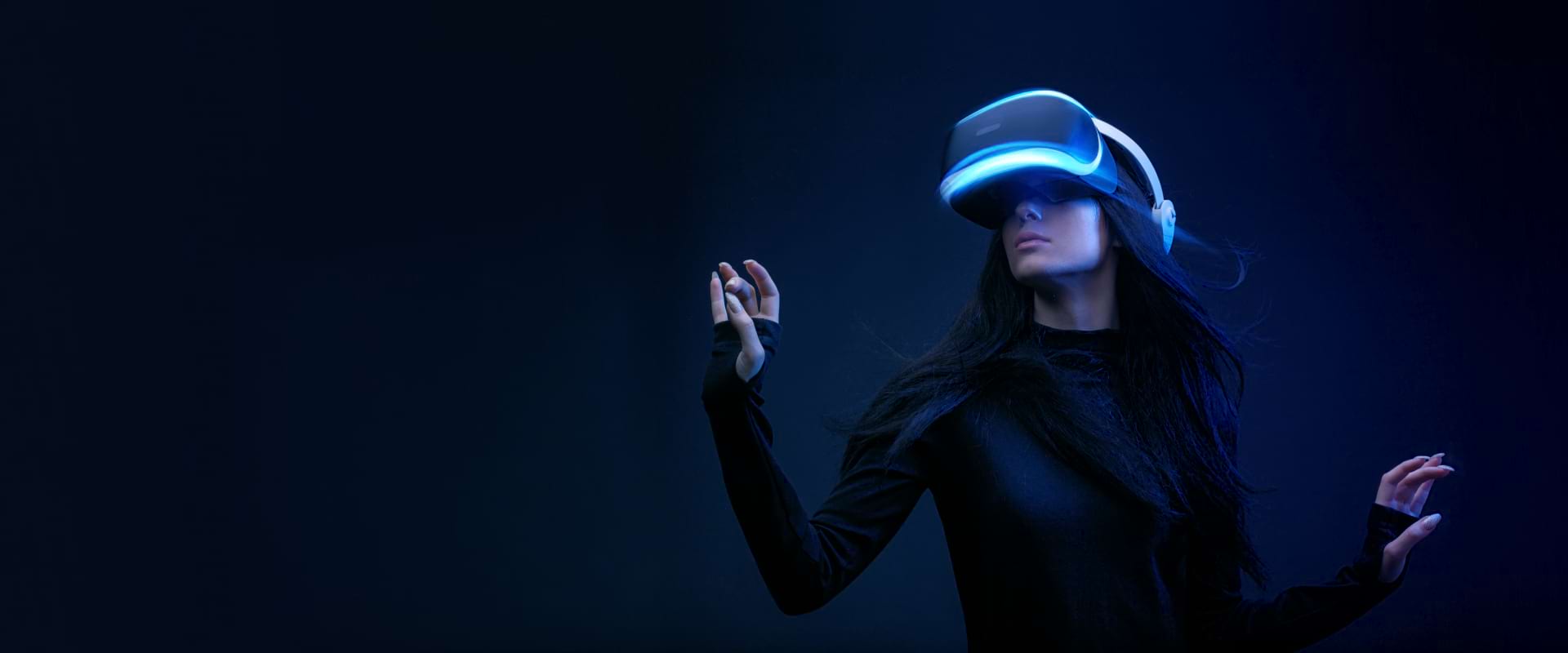 A woman wearing a virtual reality headset, immersed in a digital experience.